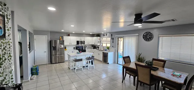 a workspace with furniture and a chandelier