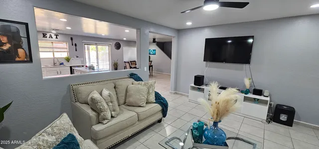 a living room with furniture and a flat screen tv
