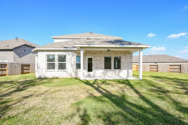 a view of a yard in front of a house