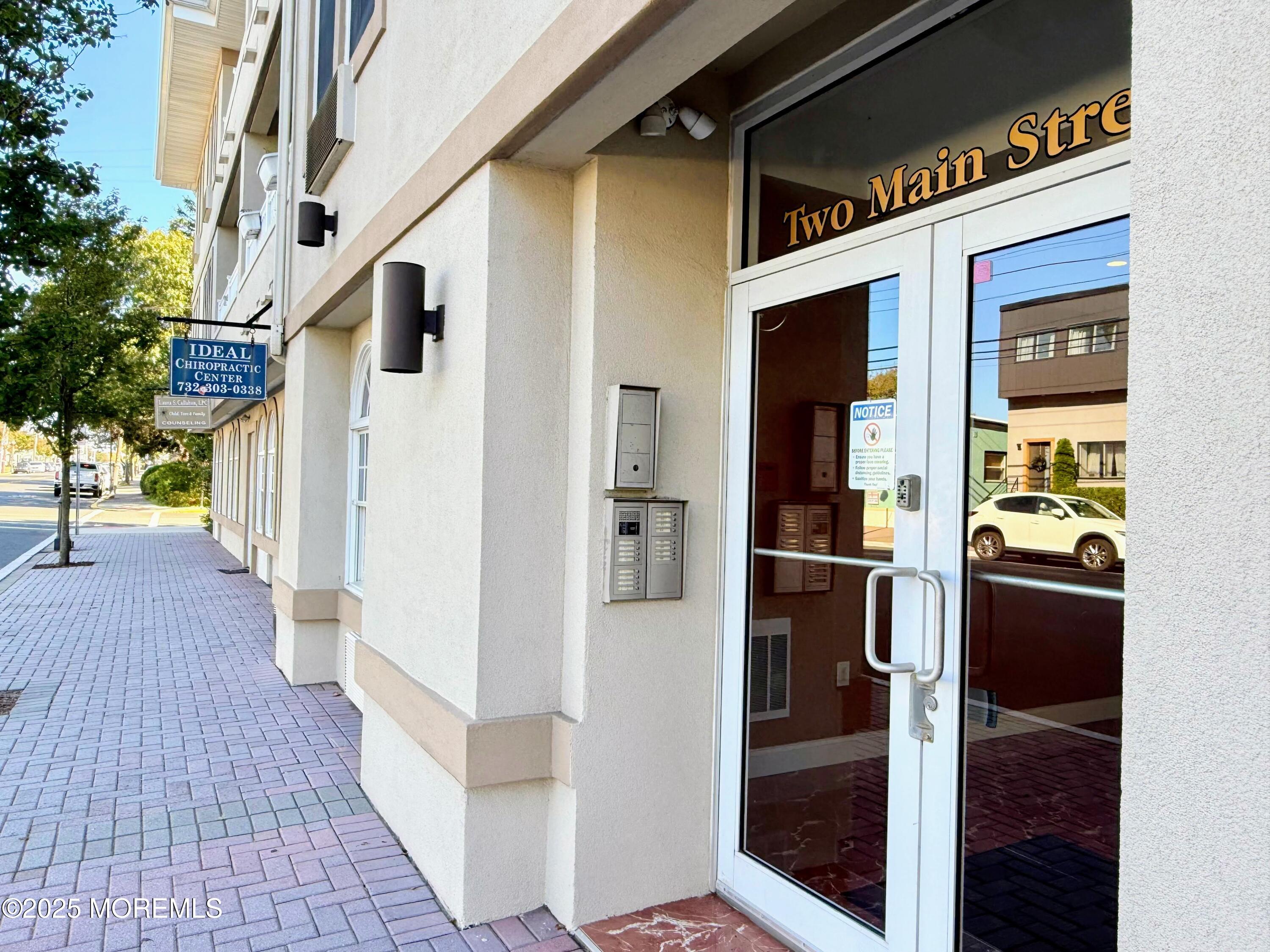 2 Main Street, Unit 308 Bradley Beach, NJ 07720 - Photo 4 of 31 front view of a house with a door