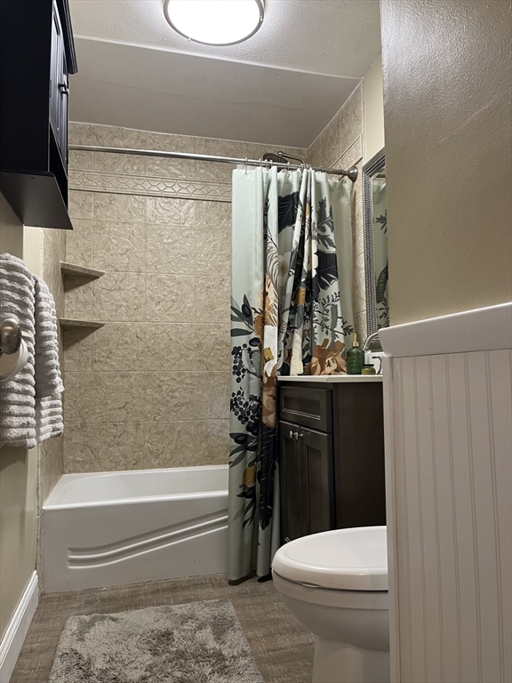 116 Boston Post Road East, Unit 101 Marlborough, MA 01752 - Photo 23 of 34 a bathroom with a toilet and a shower