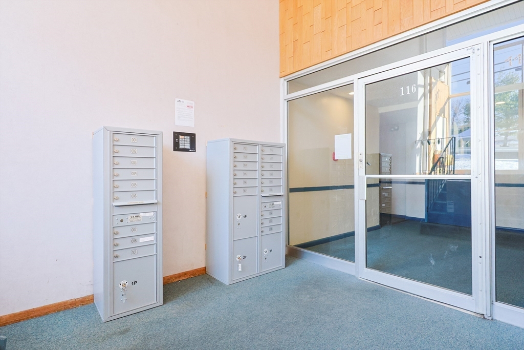 116 Boston Post Road East, Unit 101 Marlborough, MA 01752 - Photo 29 of 34 an empty room with windows and an empty room
