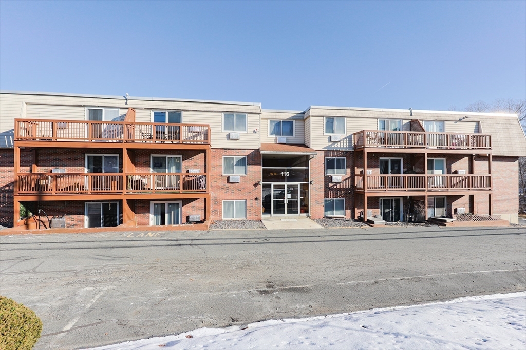 116 Boston Post Road East, Unit 101 Marlborough, MA 01752 - Photo 31 of 34 a front view of a building with glass windows