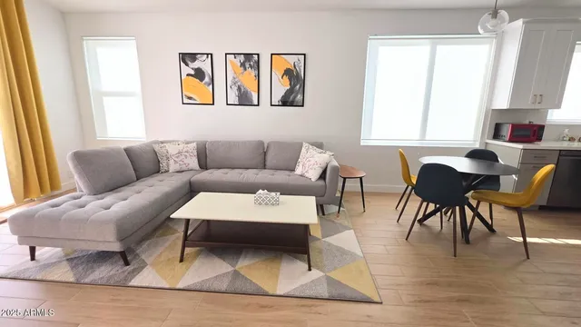 a living room with furniture and a window