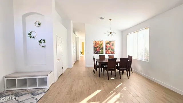 a view of a dining room with furniture window and outside view