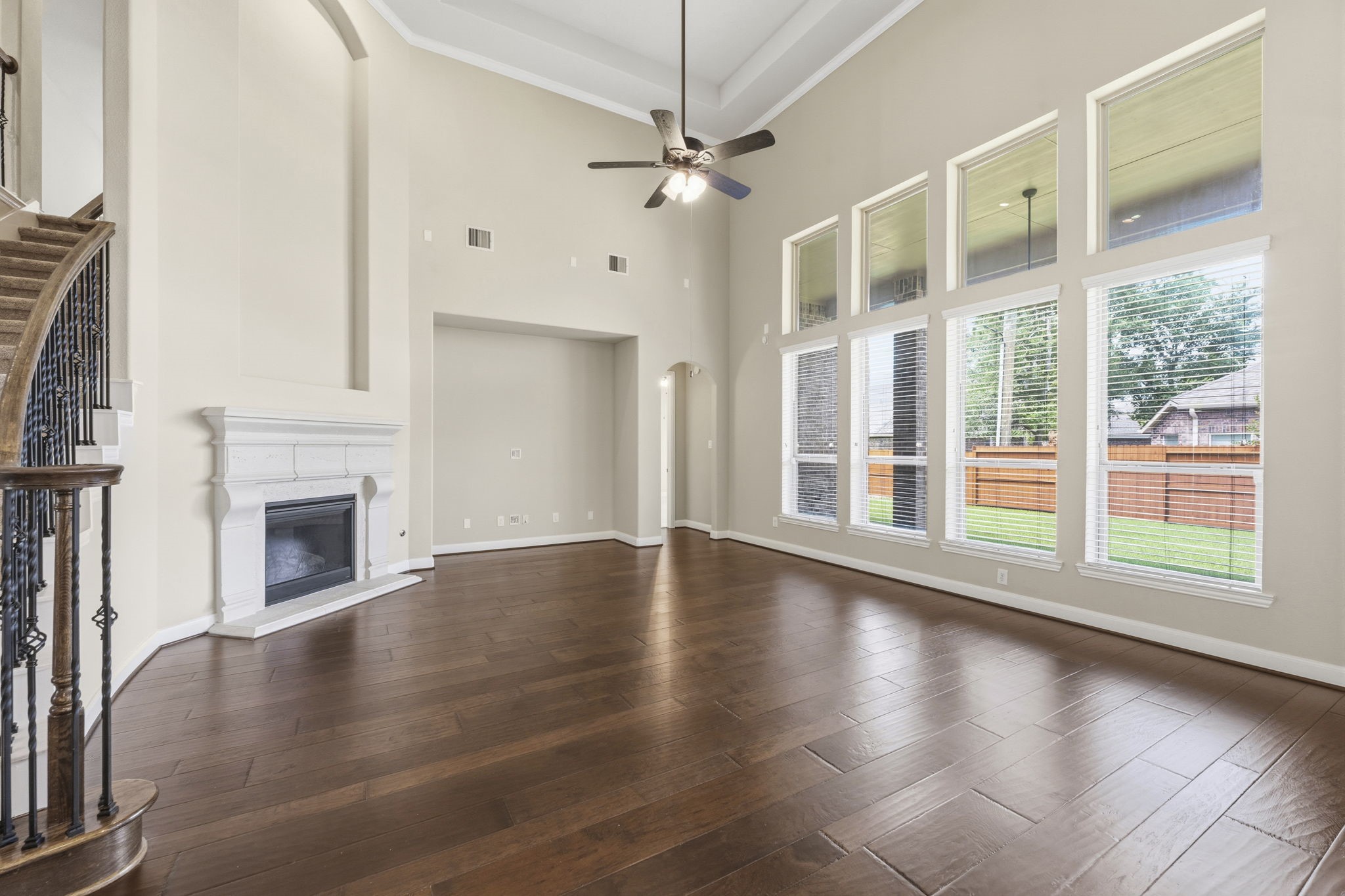 25210 Gaddis Oaks Drive Spring, TX 77389 - Photo 15 of 50 an empty room with windows and a fireplace