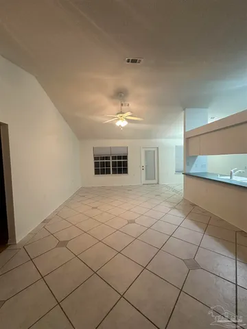 a view of a room with a wooden floor and cabinet