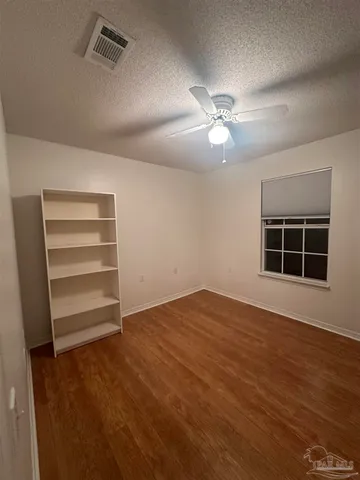 a view of a livingroom with windows
