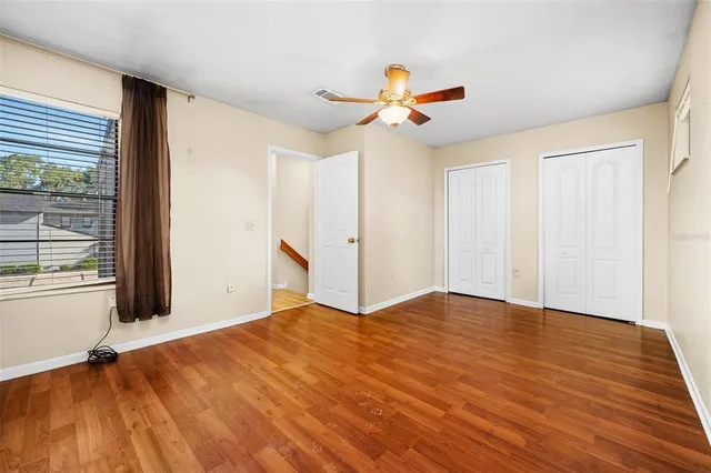 a view of a room with wooden floor