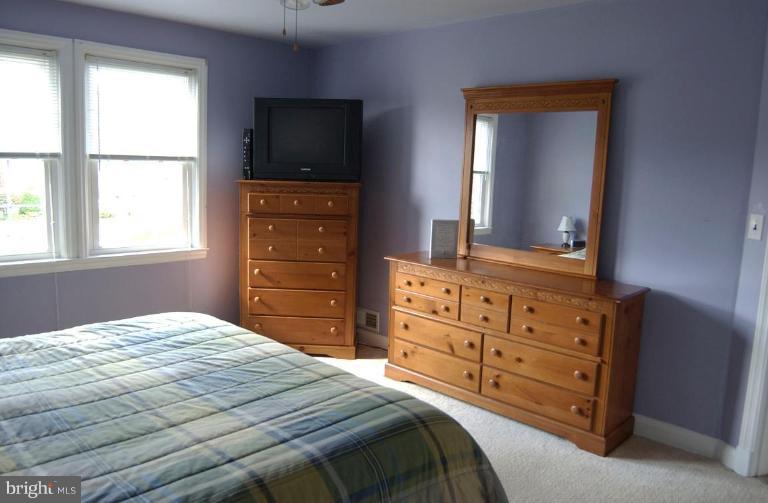 403 Greenlow Road Catonsville, MD 21228 - Photo 11 of 26 a bedroom with a bed and a dresser