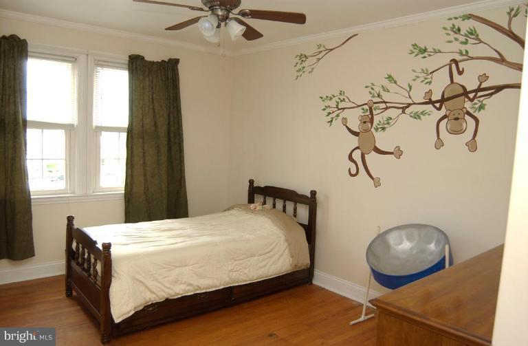 403 Greenlow Road Catonsville, MD 21228 - Photo 13 of 26 a bedroom with a bed and window