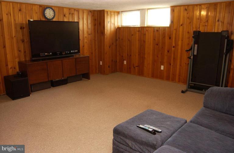 403 Greenlow Road Catonsville, MD 21228 - Photo 15 of 26 a living room with furniture and a flat screen tv