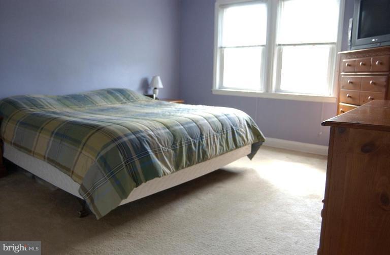 403 Greenlow Road Catonsville, MD 21228 - Photo 18 of 26 a bedroom with a bed and window