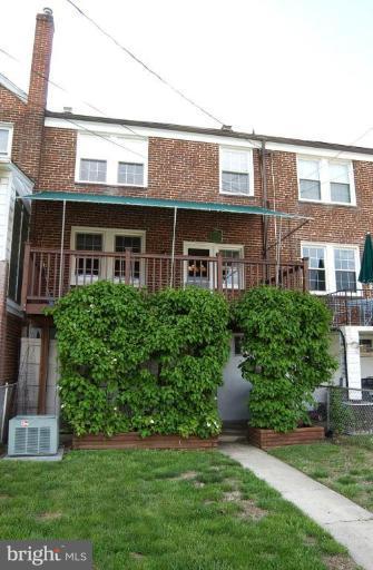 403 Greenlow Road Catonsville, MD 21228 - Photo 22 of 26 a front view of a house with a garden