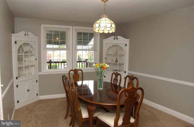 403 Greenlow Road Catonsville, MD 21228 - Photo 7 of 26 a view of a dining room with furniture and chandelier