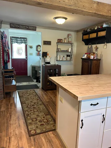 a kitchen with kitchen island a counter top space a sink and appliances