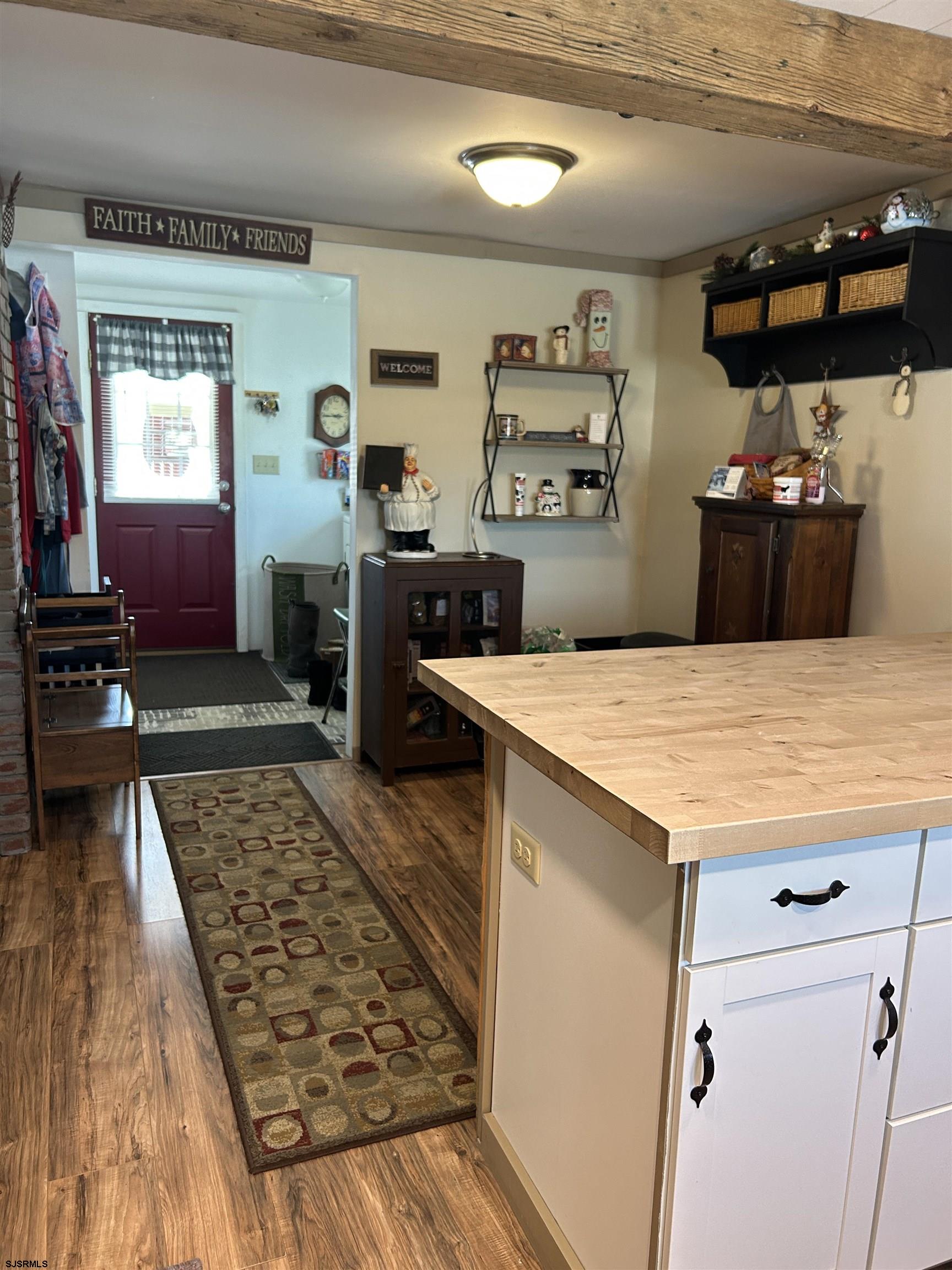 390 Jones Island Road Cedarville, NJ 08311 - Photo 13 of 41 a kitchen with kitchen island a counter top space a sink and appliances