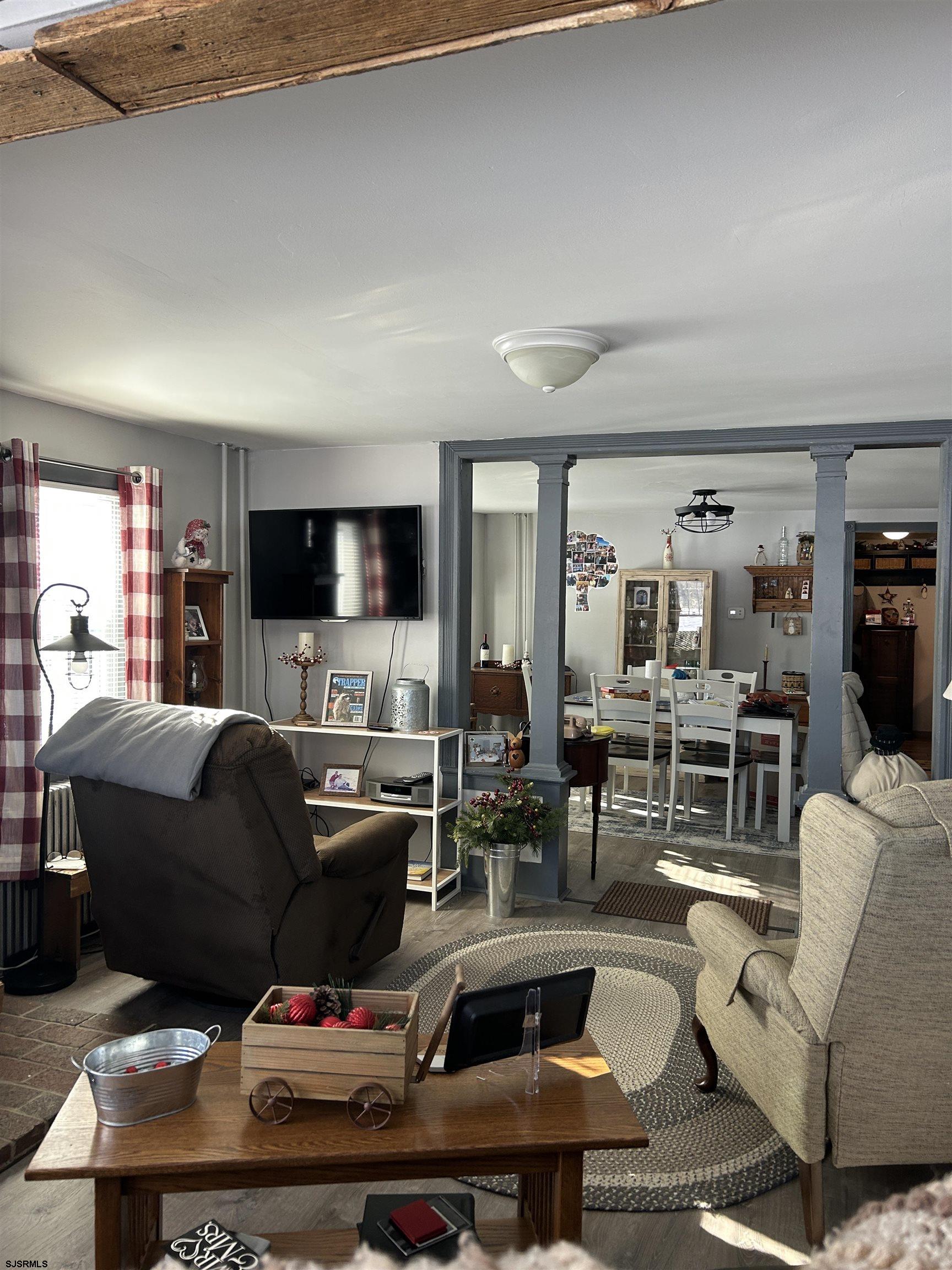 390 Jones Island Road Cedarville, NJ 08311 - Photo 22 of 41 a living room with furniture and a flat screen tv