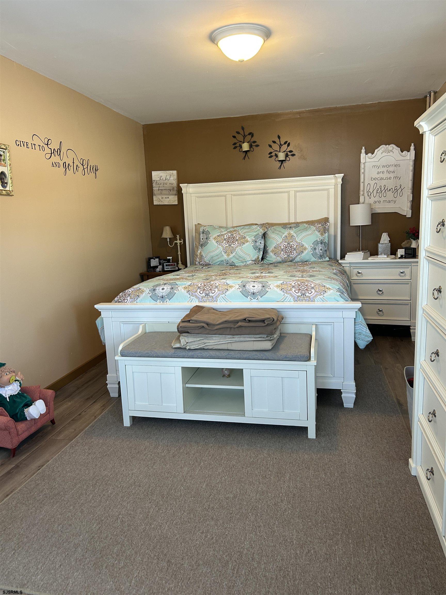 390 Jones Island Road Cedarville, NJ 08311 - Photo 24 of 41 a bedroom with a bed and a mirror