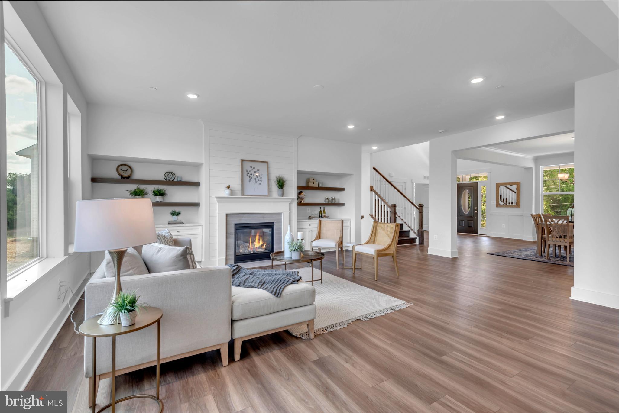 1331 German Driveway Hanover, MD 21076 - Photo 12 of 87 a living room with fireplace furniture and a wooden floor