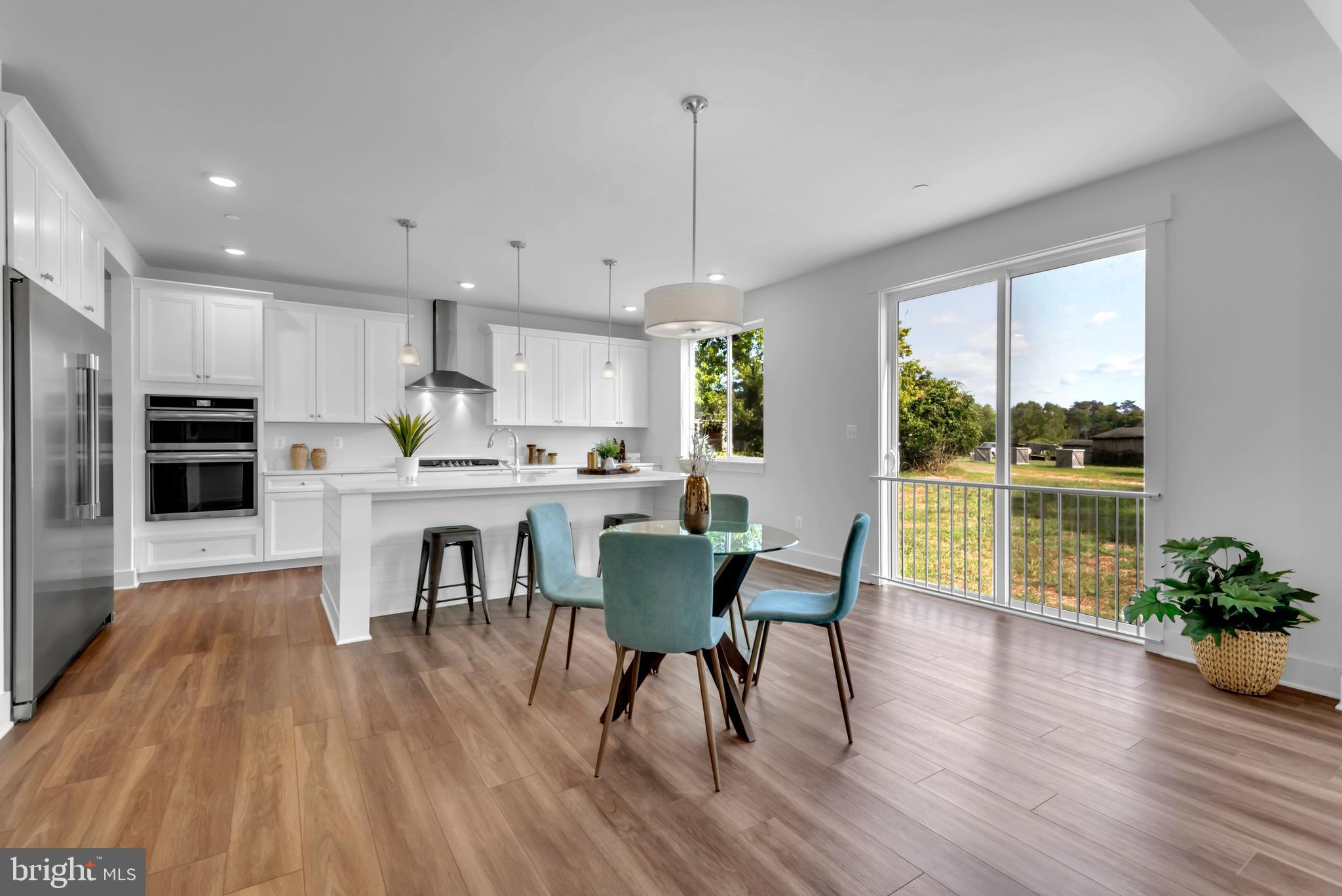 1331 German Driveway Hanover, MD 21076 - Photo 13 of 87 a view of a dining room with furniture window and wooden floor