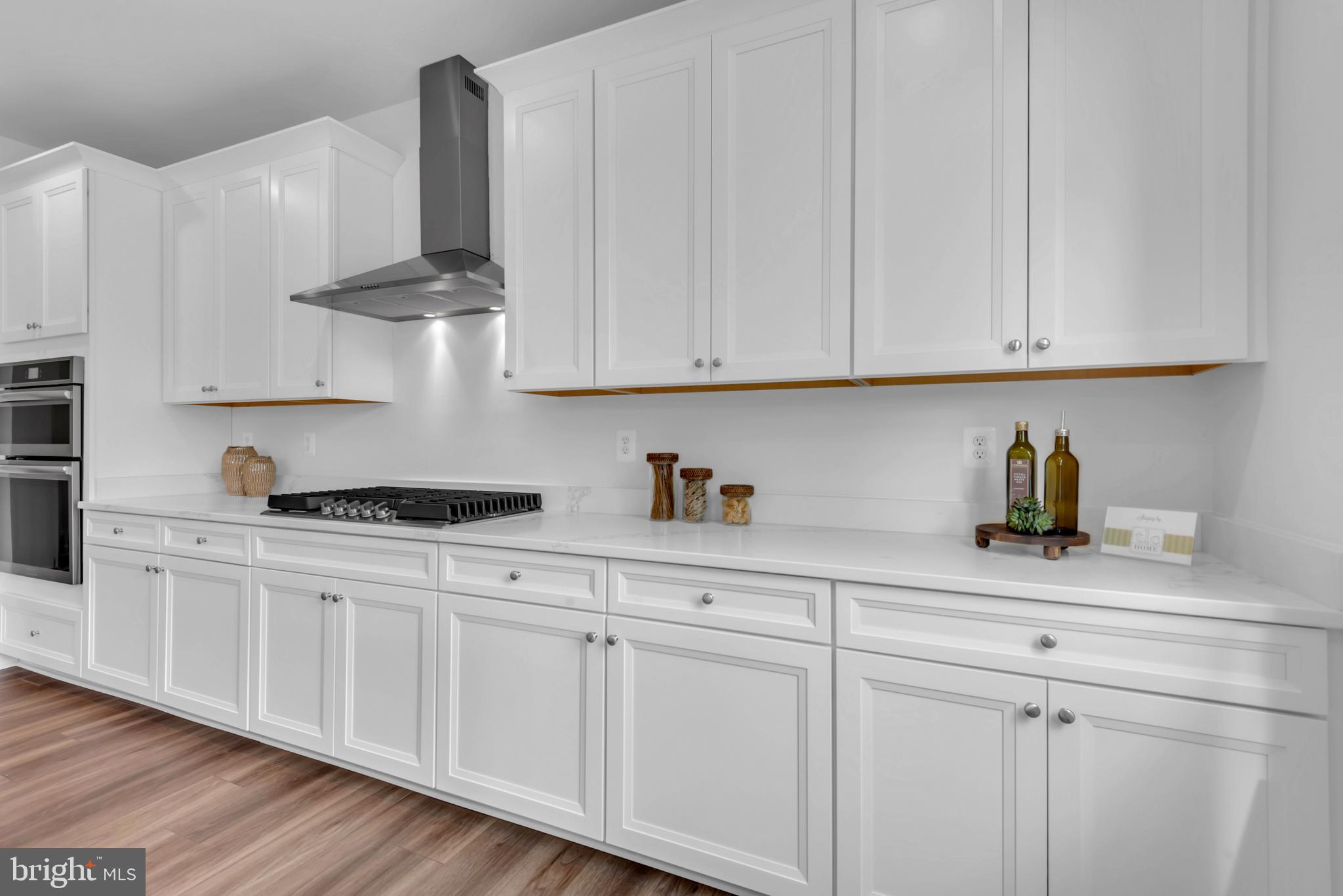 1331 German Driveway Hanover, MD 21076 - Photo 20 of 87 a kitchen with stainless steel appliances granite countertop white cabinets and a sink