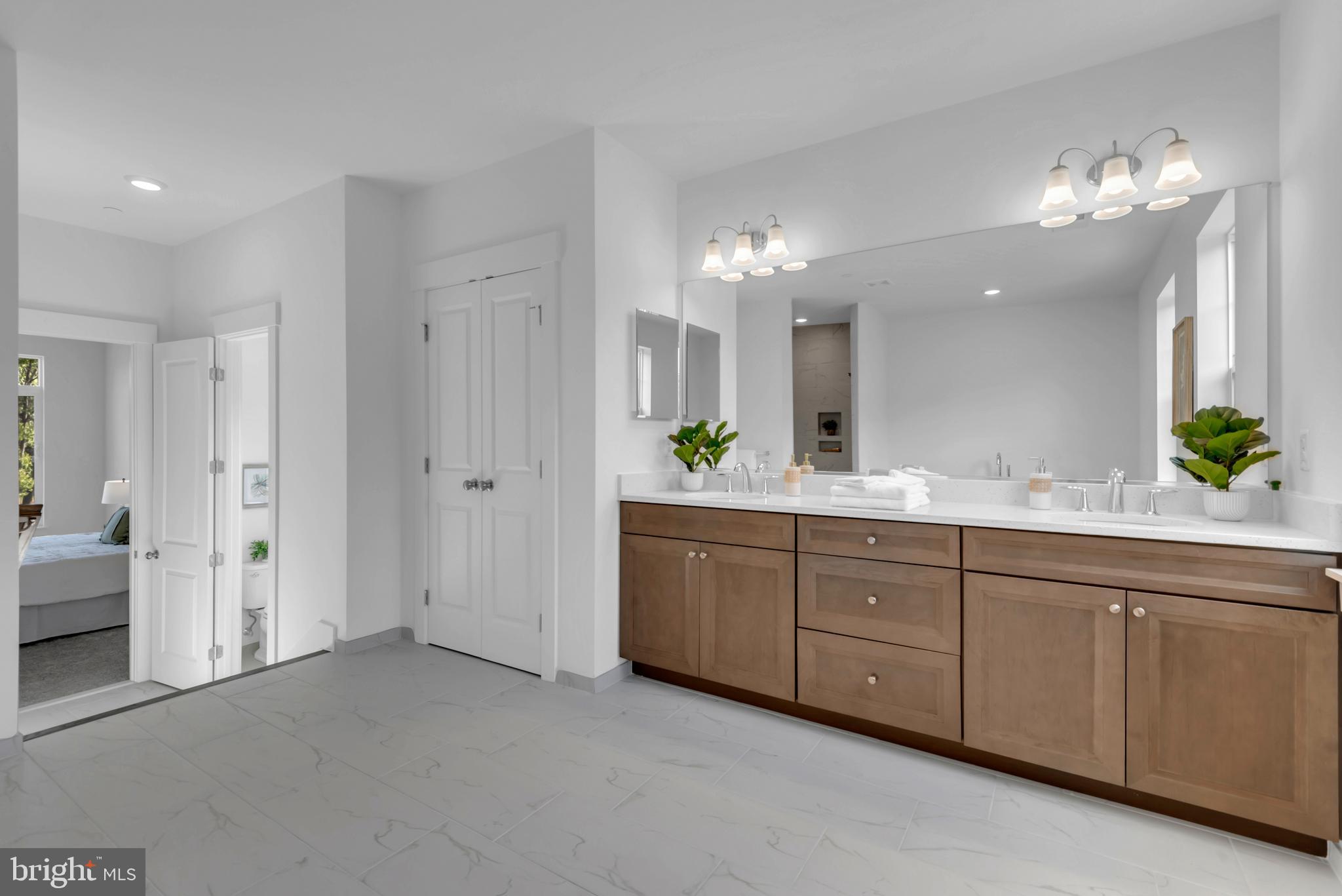 1331 German Driveway Hanover, MD 21076 - Photo 36 of 87 a spacious bathroom with a double vanity sink and a mirror