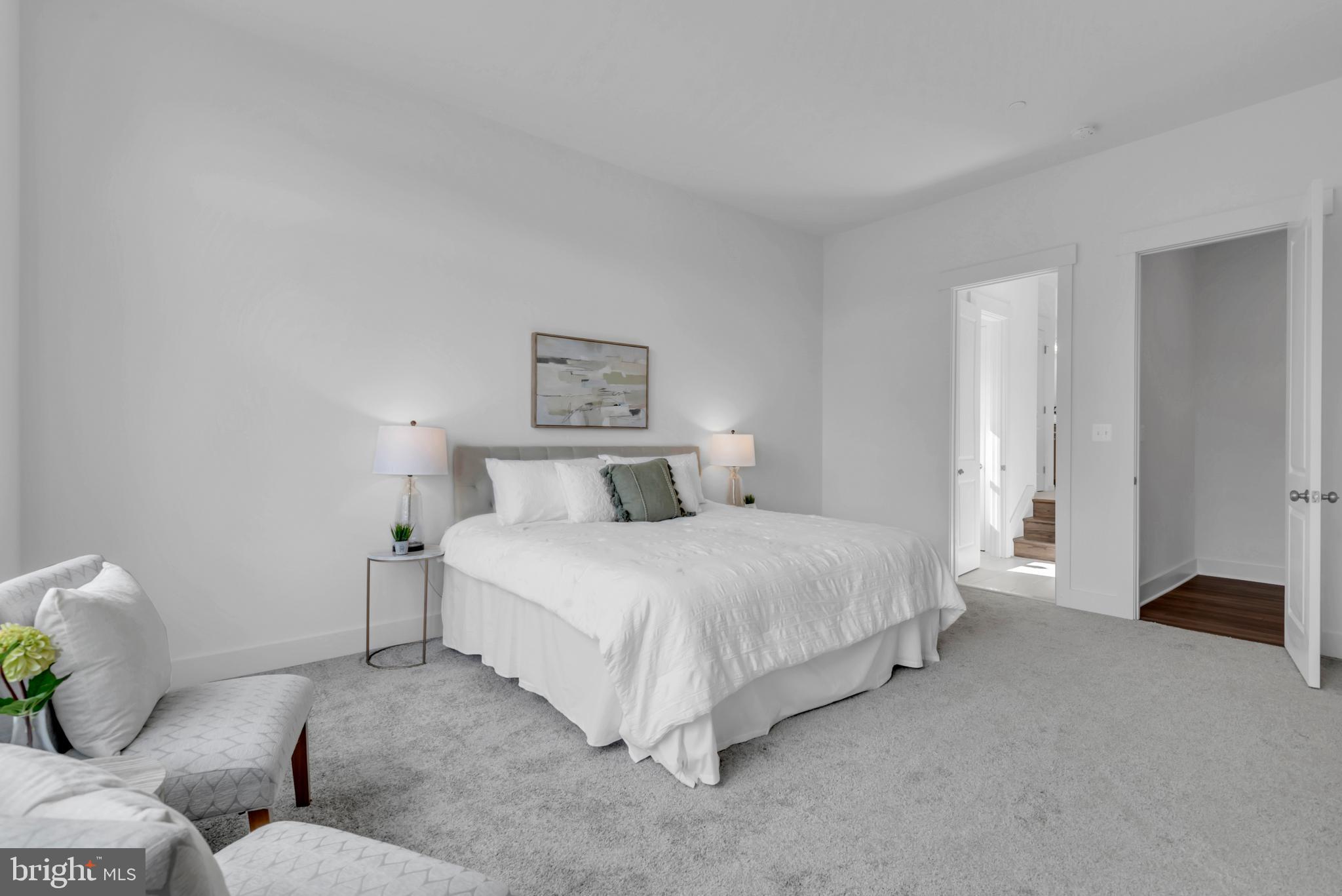 1331 German Driveway Hanover, MD 21076 - Photo 42 of 87 a spacious bedroom with a bed and a couch