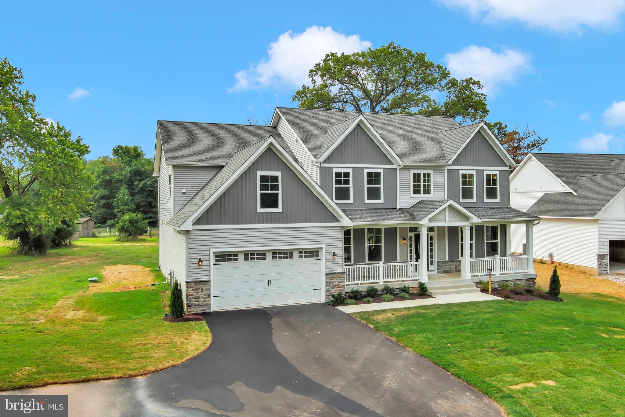 1331 German Driveway Hanover, MD 21076 - Photo 5 of 87 front view of a house with a yard