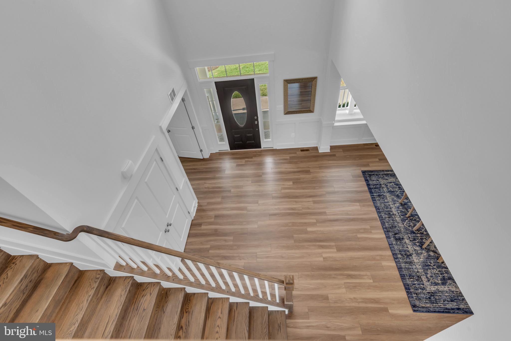 1331 German Driveway Hanover, MD 21076 - Photo 56 of 87 a view of a hallway with wooden floor and staircase