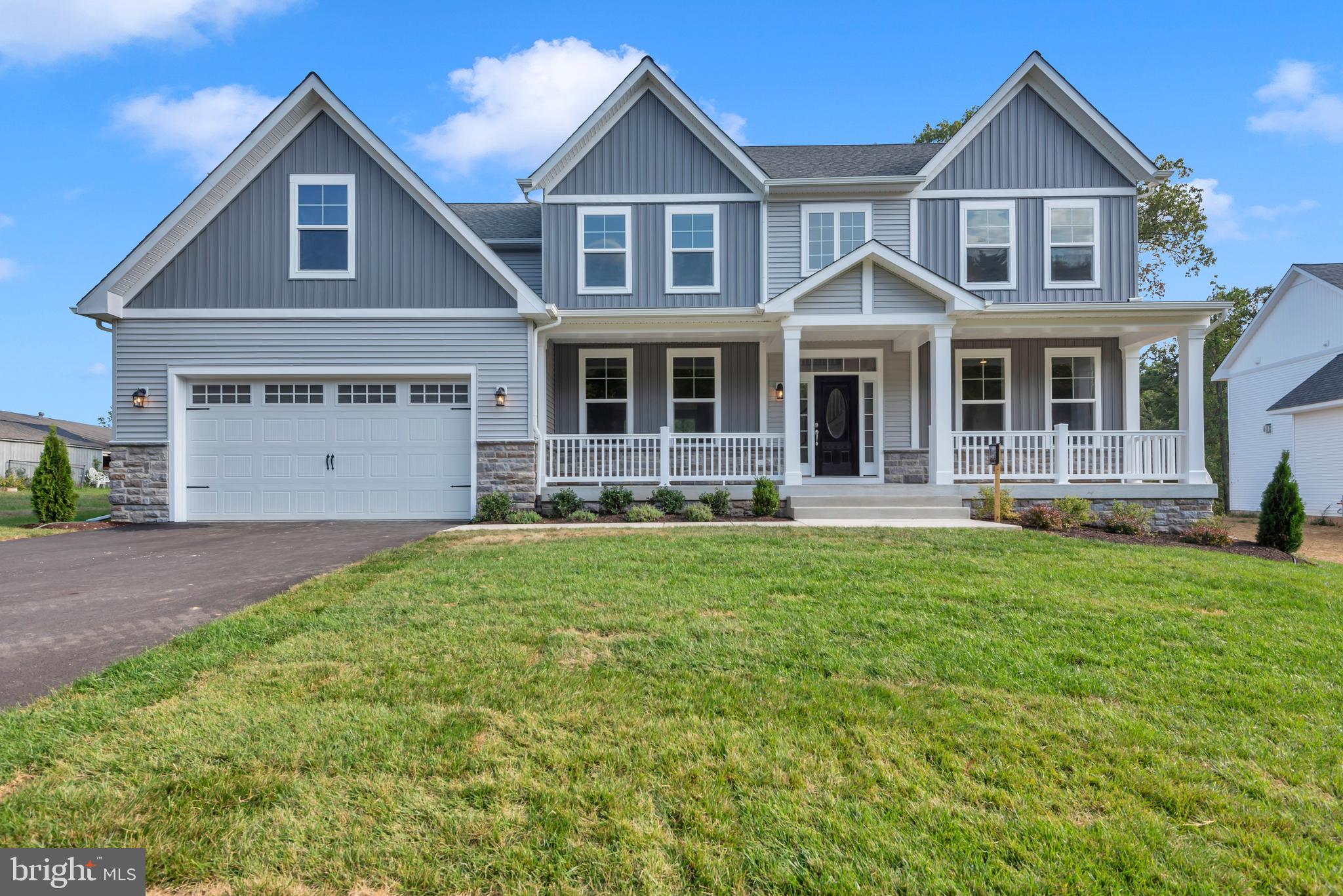 1331 German Driveway Hanover, MD 21076 - Photo 6 of 87 a front view of a house with a yard and garage