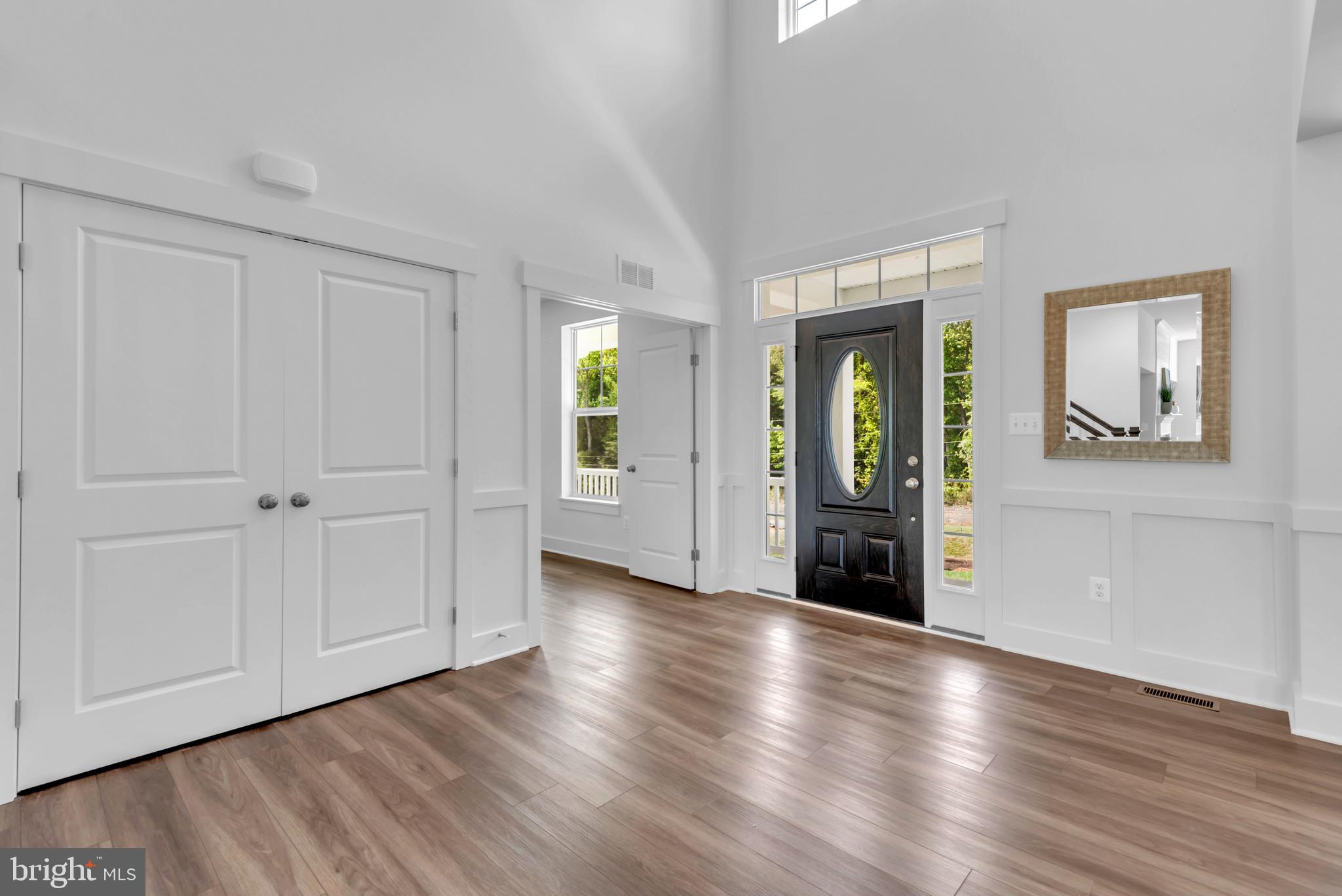 1331 German Driveway Hanover, MD 21076 - Photo 9 of 87 a view of an empty room with wooden floor and a window