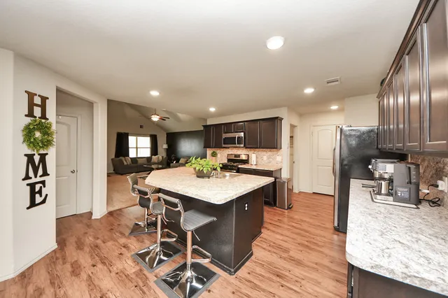 a kitchen with a table and chairs in it