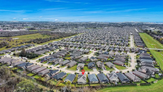 an aerial view of residential houses with outdoor space