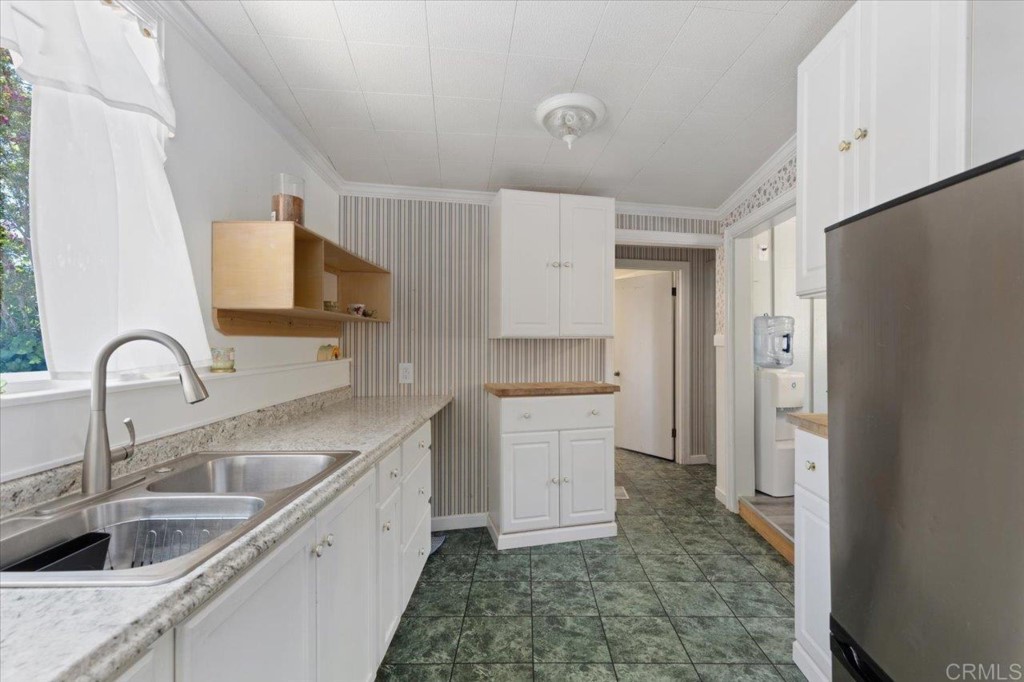365 Eldorado Drive Escondido, CA 92025 - Photo 19 of 36 a kitchen with a sink and a refrigerator