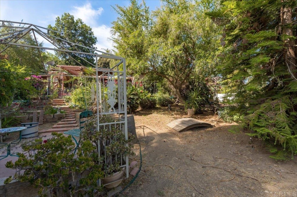 365 Eldorado Drive Escondido, CA 92025 - Photo 25 of 36 a backyard of a house with lots of green space