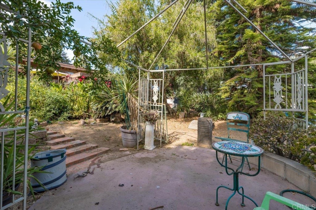 365 Eldorado Drive Escondido, CA 92025 - Photo 26 of 36 a view of a chairs and table in the backyard