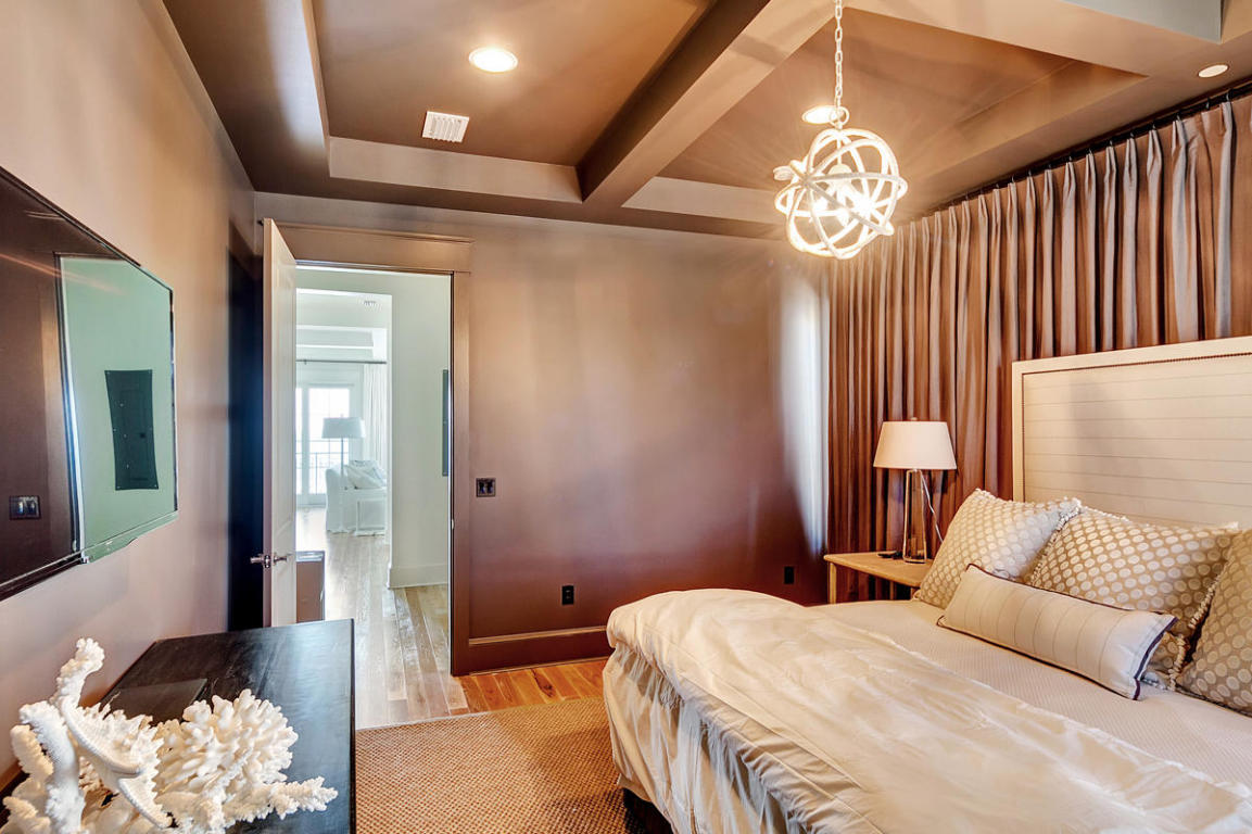 7 Winston Ln Inlet Beach Inlet Beach, FL 32461 - Photo 14 of 19 a bedroom with a bed and a chandelier