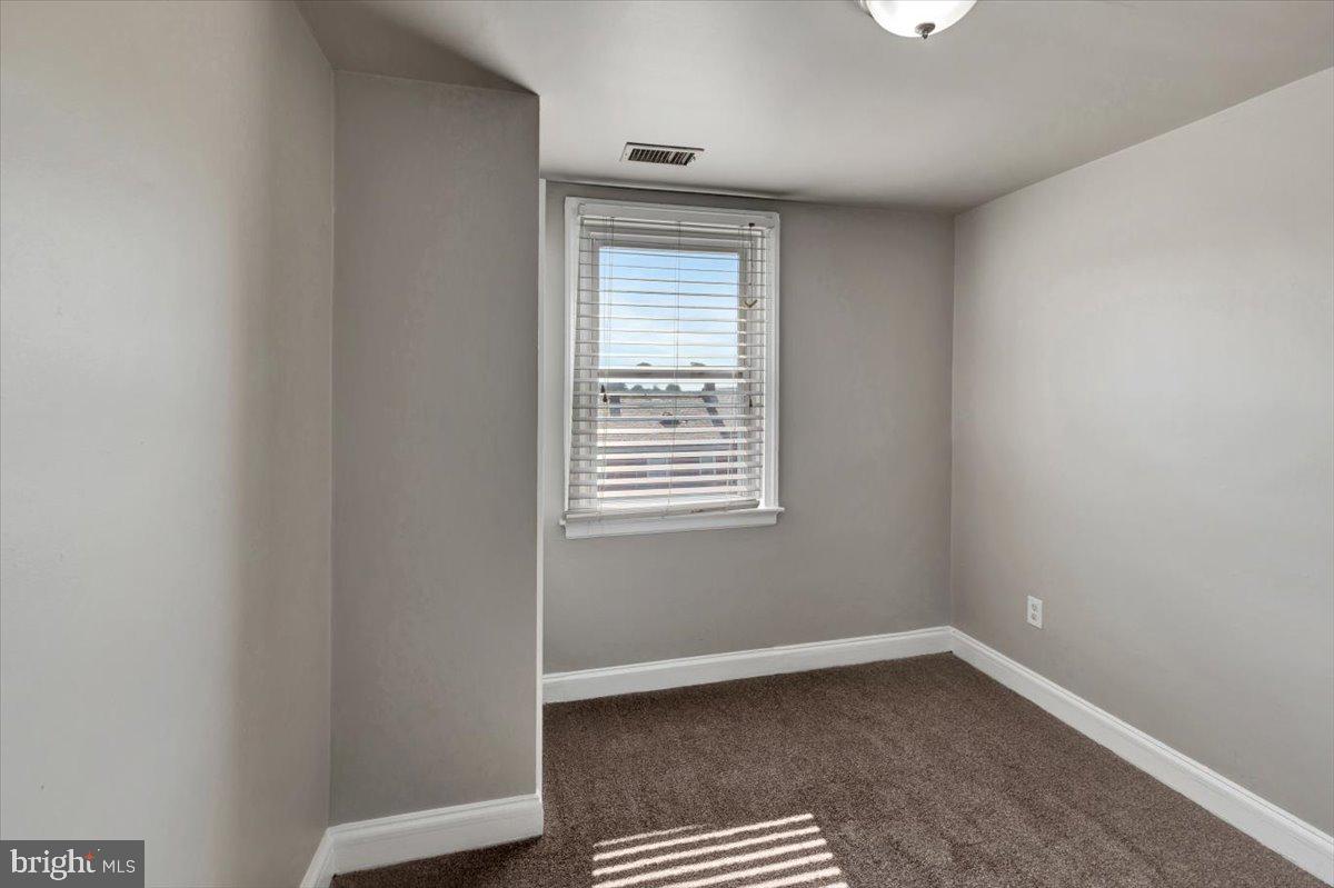 3927 Yolando Road Baltimore, MD 21218 - Photo 18 of 50 a view of an empty room with a window