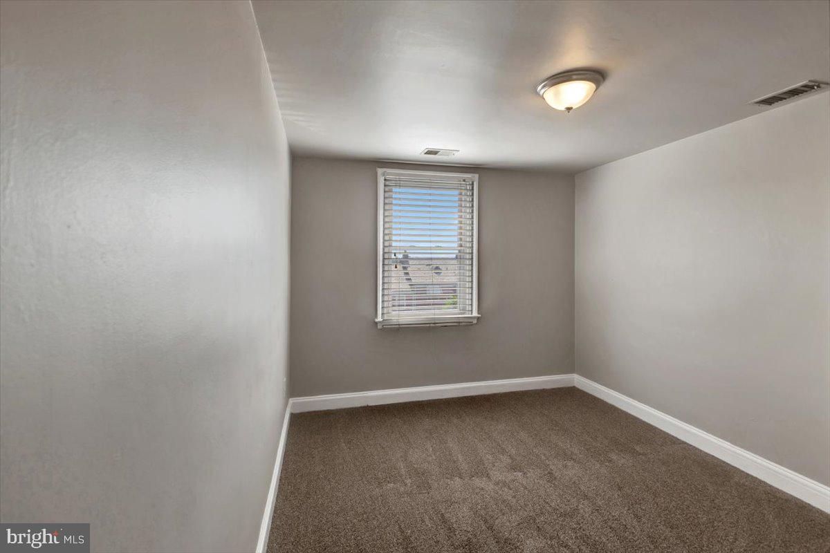 3927 Yolando Road Baltimore, MD 21218 - Photo 20 of 50 an empty room with a window