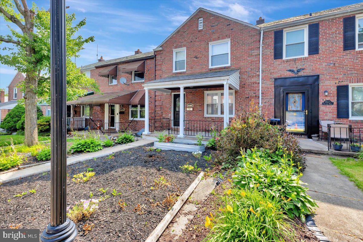 3927 Yolando Road Baltimore, MD 21218 - Photo 2 of 50 a front view of a house with garden