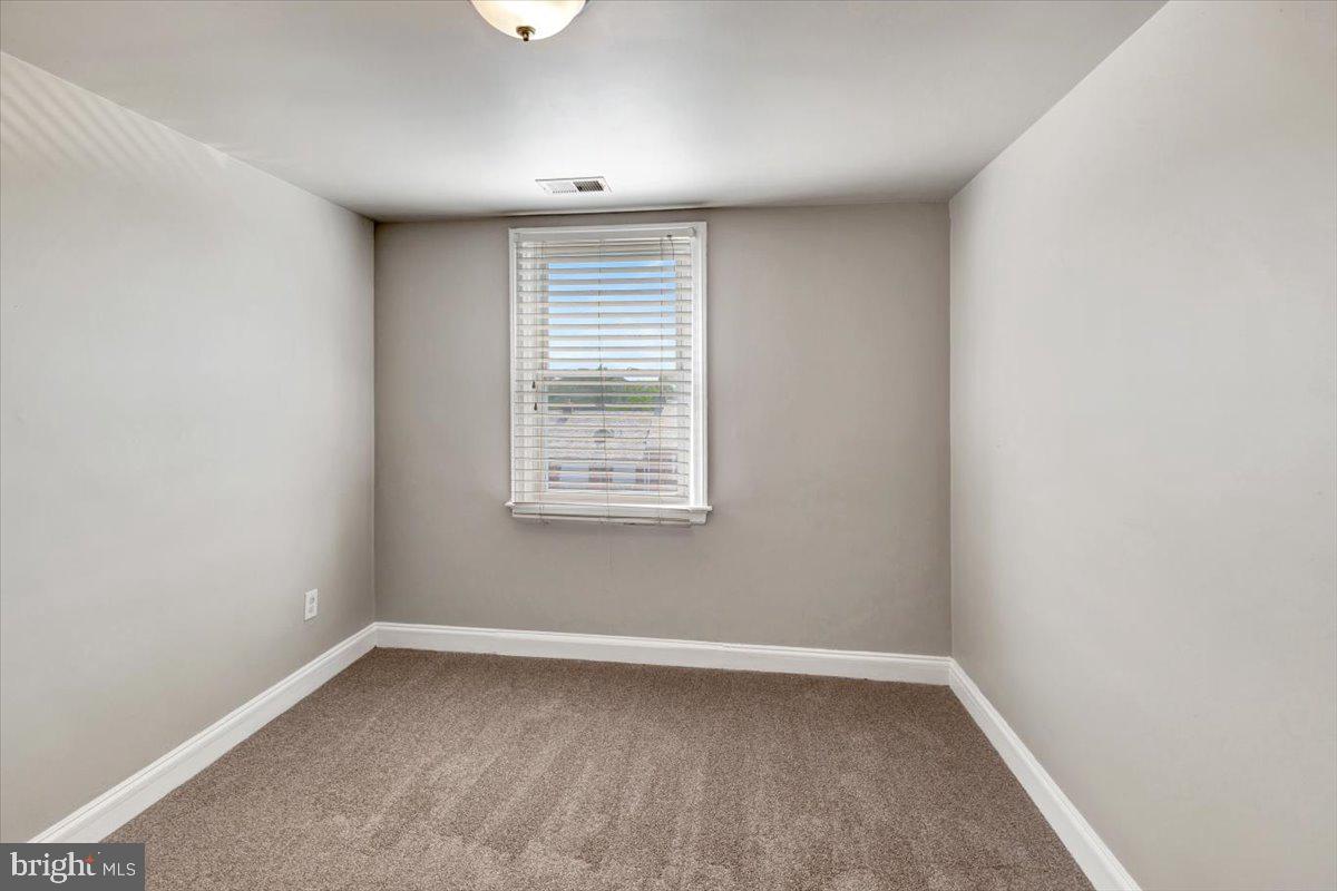 3927 Yolando Road Baltimore, MD 21218 - Photo 22 of 50 an empty room with a window