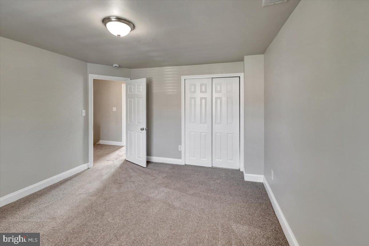 3927 Yolando Road Baltimore, MD 21218 - Photo 25 of 50 an empty room with windows