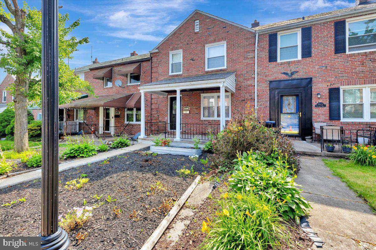3927 Yolando Road Baltimore, MD 21218 - Photo 3 of 50 a front view of a house with garden