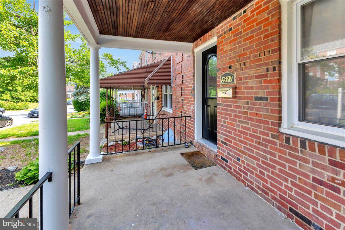 3927 Yolando Road Baltimore, MD 21218 - Photo 4 of 50 a view of a porch with wooden floor and stairs