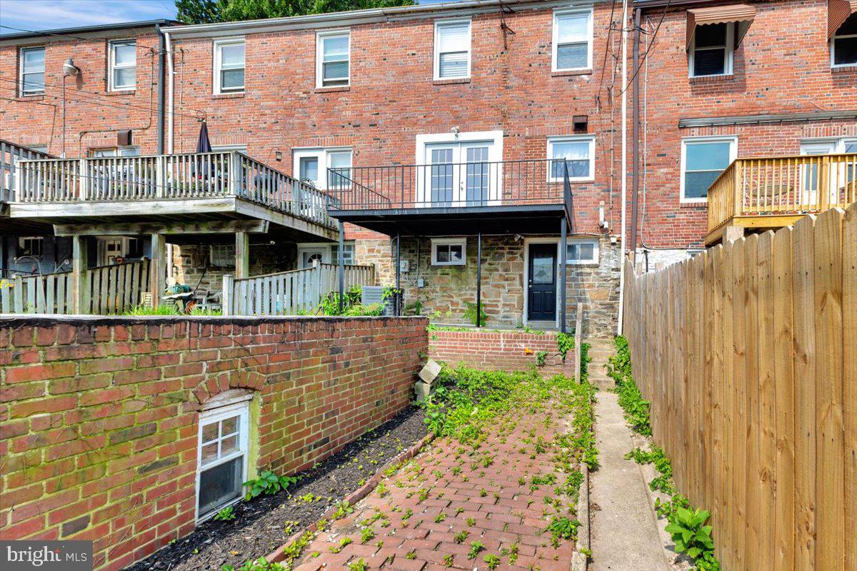 3927 Yolando Road Baltimore, MD 21218 - Photo 46 of 50 a front view of a house with a garden