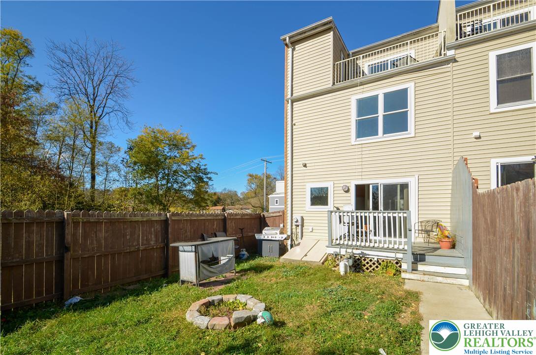 70 Chesapeake Street Lancaster, PA 17602 - Photo 32 of 35 a backyard of a house with barbeque oven and fence