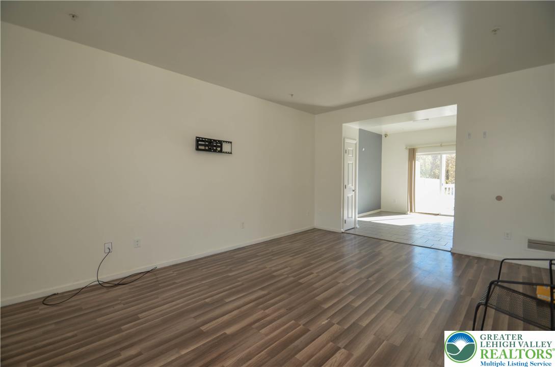 70 Chesapeake Street Lancaster, PA 17602 - Photo 4 of 35 an empty room with wooden floor and windows
