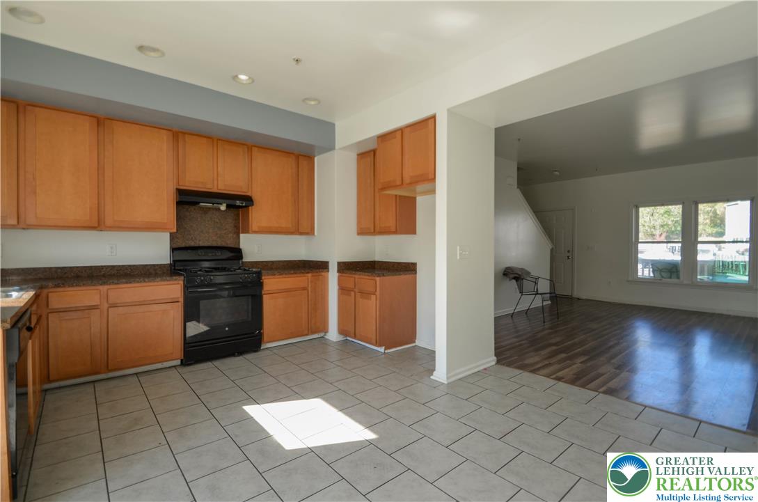 70 Chesapeake Street Lancaster, PA 17602 - Photo 5 of 35 a kitchen with a refrigerator and a stove top oven