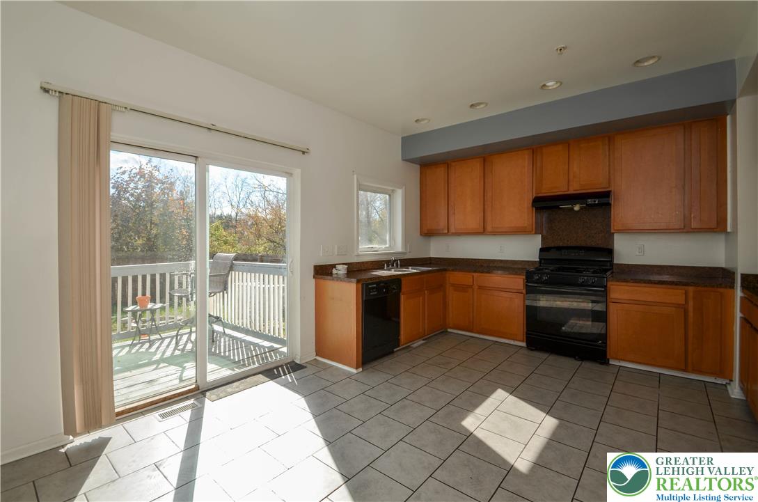 70 Chesapeake Street Lancaster, PA 17602 - Photo 7 of 35 a kitchen with a stove a sink and a refrigerator